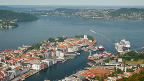 a view of the city of bergen below are the marinas and large cruise ships 4k video