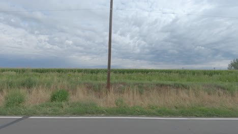 a drive along an american country road with views of fields