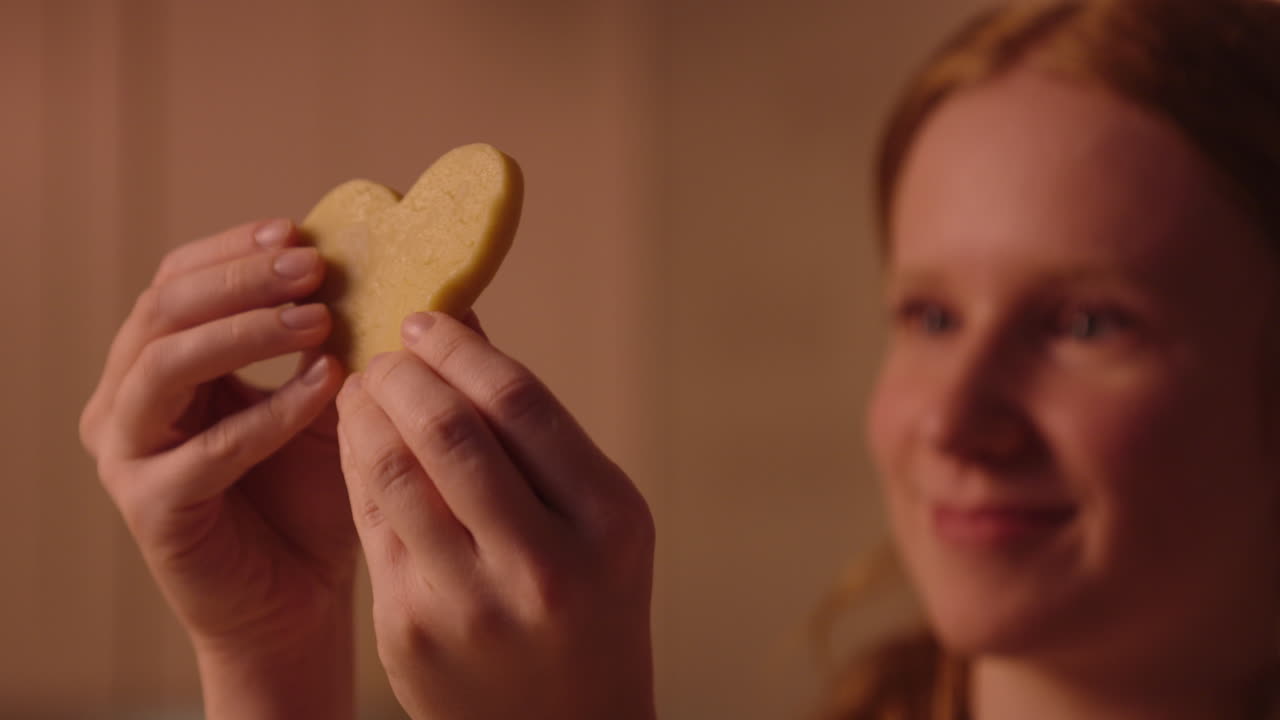 Girl Holding a Heart Shaped Cookie