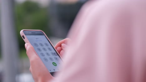 a young girl is dressed in a pink jacket she uses a smartphone for notifications a young girl is dressed in a pink jacket she uses a smartphone for notifications woman wearing sunglasses slow motion
