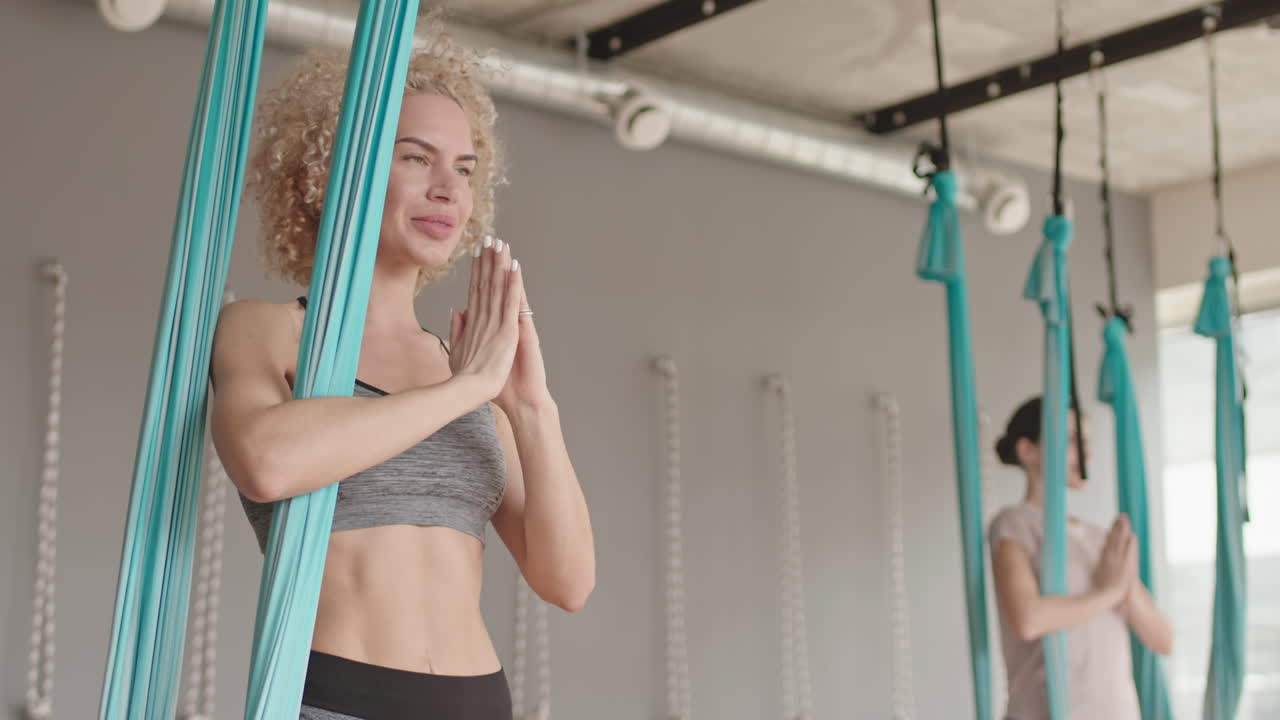 Blonde Woman in Aerial Yoga Class