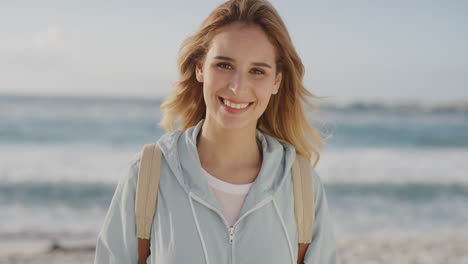 portrait of cute blonde woman smiling enjoying summer day on beach vacation looking calm relaxed satisfaction