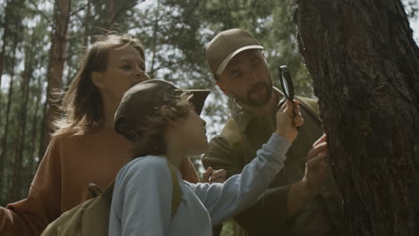 family exploring nature in the forest