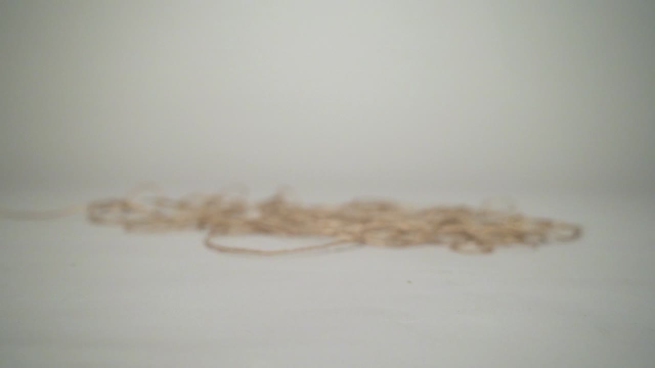 Closer movement and leaning skein moving with a natural grey background