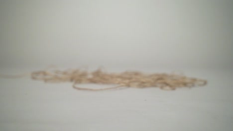 Closer-movement-and-leaning-skein-moving-with-a-natural-grey-background