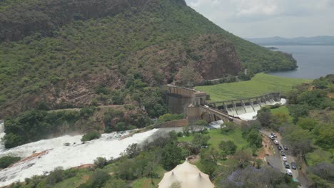 traffic waits to cross bridge across hartbeespoort dam wall