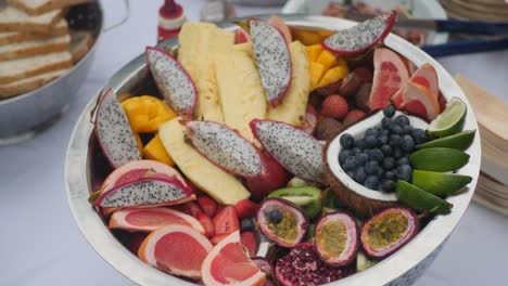 wide angle on top of a tropical multi fruits bowl on a table