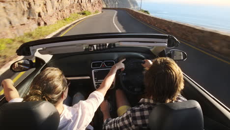 Couple-driving-convertible-car-cabriolet-cape-town-south-africa-steadicam-shot