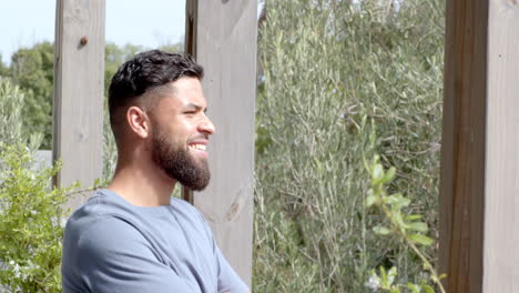 smiling man standing outdoors, enjoying nature and fresh air at home, copy space