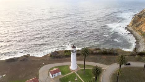 Aerial-flyover-view,-Point-Vicente-Lighthouse,-Pacific-Ocean-at-sunset