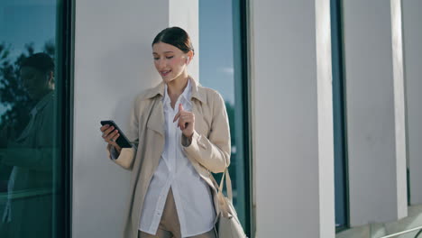 Woman-speaking-phone-video-call-on-work-break-outdoors.-Lady-talking-vertical