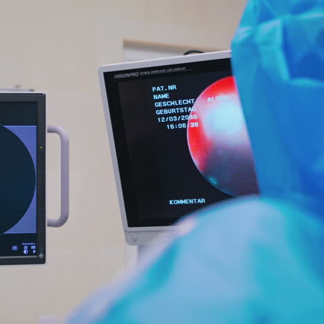 surgeon looks at display. medical specialist performs a laparoscopic operation to crush stones in the kidneys. health care.
