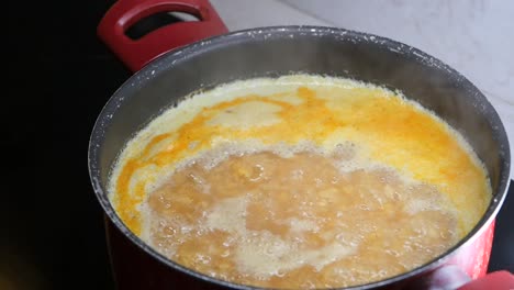 food cooking in a red pot