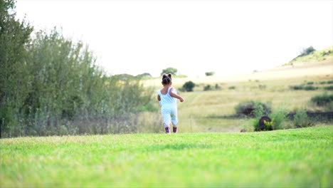 small south african girl running away from camera