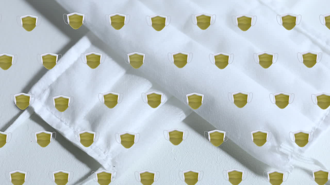 animación de escudos que se mueven sobre máscaras faciales en el fondo