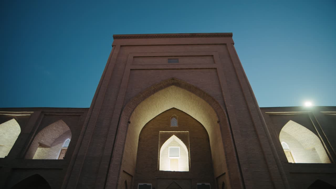 Khiva night old city mosque beautifully illuminated, Uzbekistan silk road at night