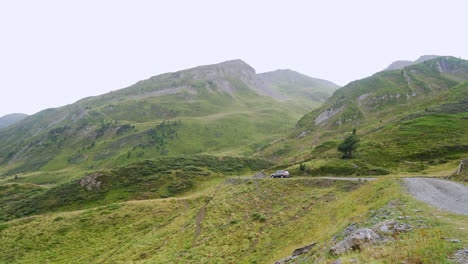 Car-driving-on-road-in-highlands