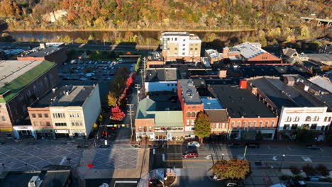 aerial establishing shot of restored storefront businesses in small town america