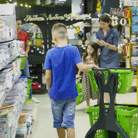vinnitsa, ukraine - august, 2018: purchase of stationery in the store. many colorful tools and supplies on the shelf of a stationery shop
