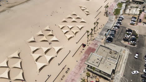 aerial view flying over huntington beach, california towards pacific ocean