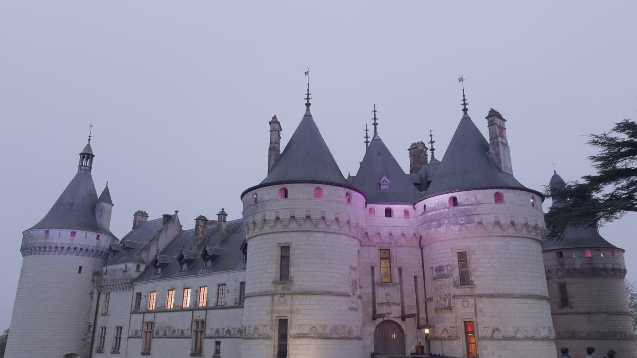 Majestic Chateau at Twilight: A Family's Evening Visit