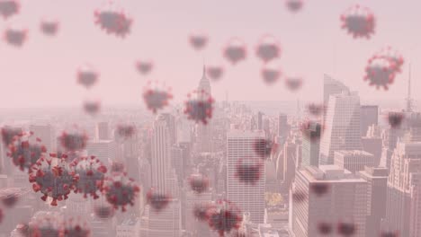 animation of covid 19 cells floating over cityscape on pink background