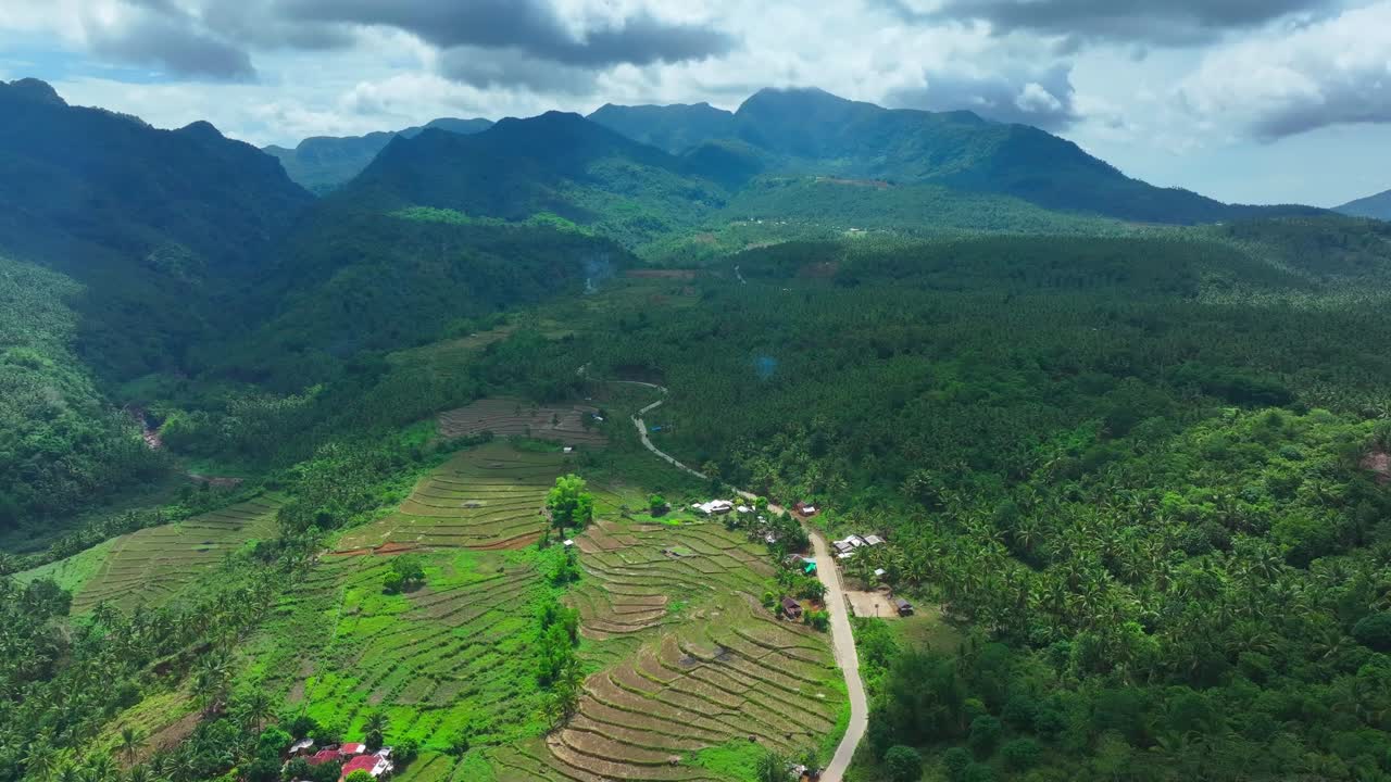 Aerial View of Lush Green Mountains and Rice Terraces