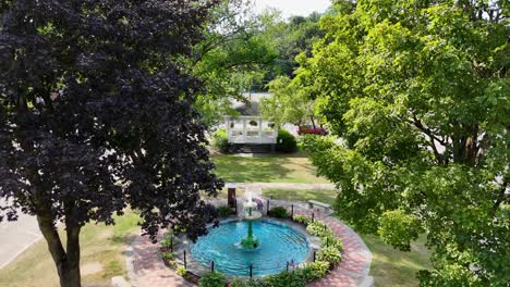 small town city square park with fountain and gazebo_aerial drone