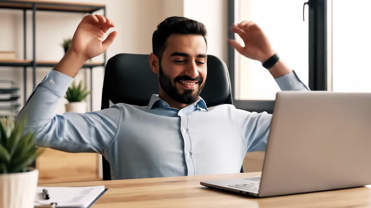 Relaxed businessman in office with laptop