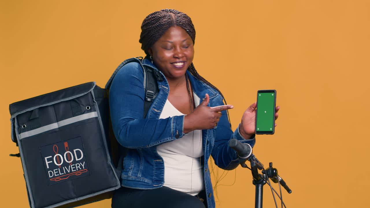 Lady Grasps Phone Showing Green Screen