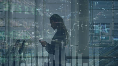 statistical data processing against caucasian businesswoman talking on smartphone at office