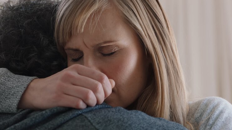 sad woman hugging boyfriend young couple having relationship trouble embracing emotional issues sharing bad news