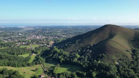 Region-of-Ascain-France-with-town-and-mountain-near-the-French-and-Spanish-border,-Aerial-flyover-shot