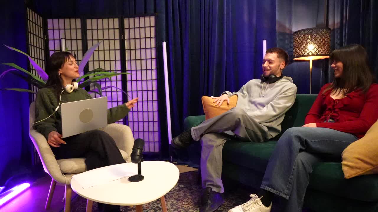 Three Young Adults Recording a Podcast in a Modern Studio