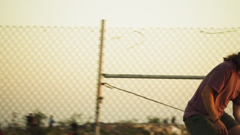 Person-with-long-curly-hair-and-beanie-ride-skateboard-in-Los-Angeles