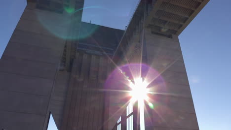 the strépy-thieu boat lift from behind and underneath the overpass with lens flare, tilting up