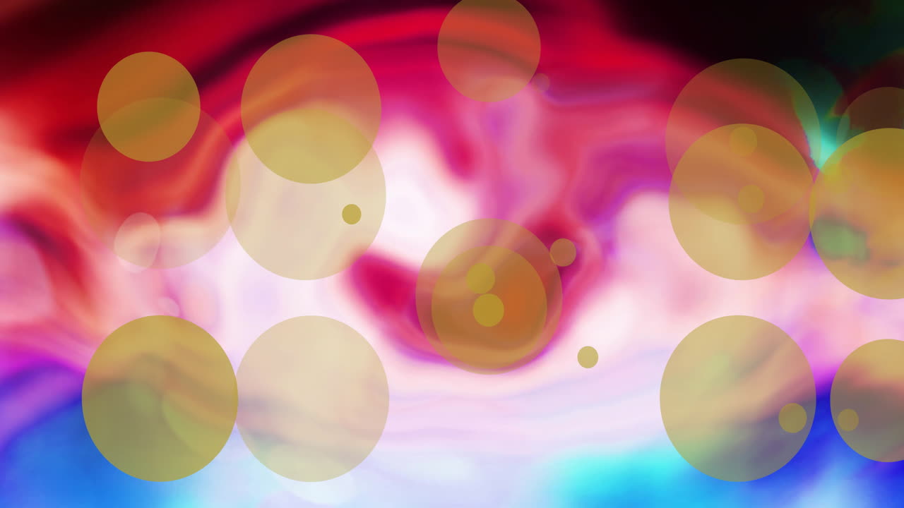 검은색 배경에 있는 다채로운 모양 위에 노란색 빛 점의 애니메이션