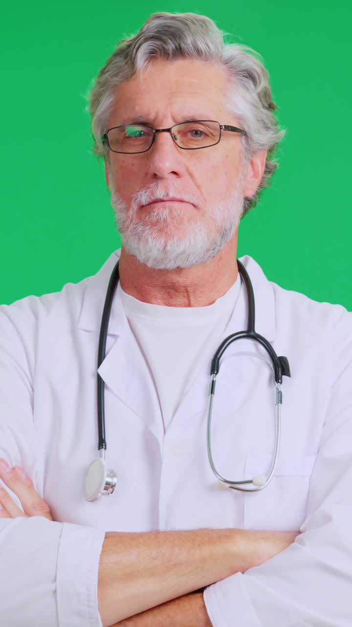 Mature Doctor in Lab Coat and Stethoscope on Green Screen