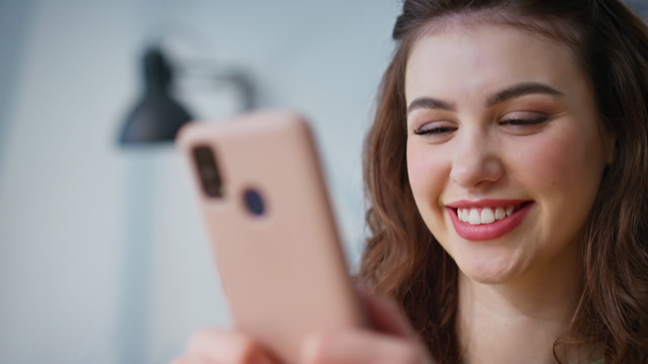 Lady hands typing cellphone at light workplace closeup. Woman messaging mobile