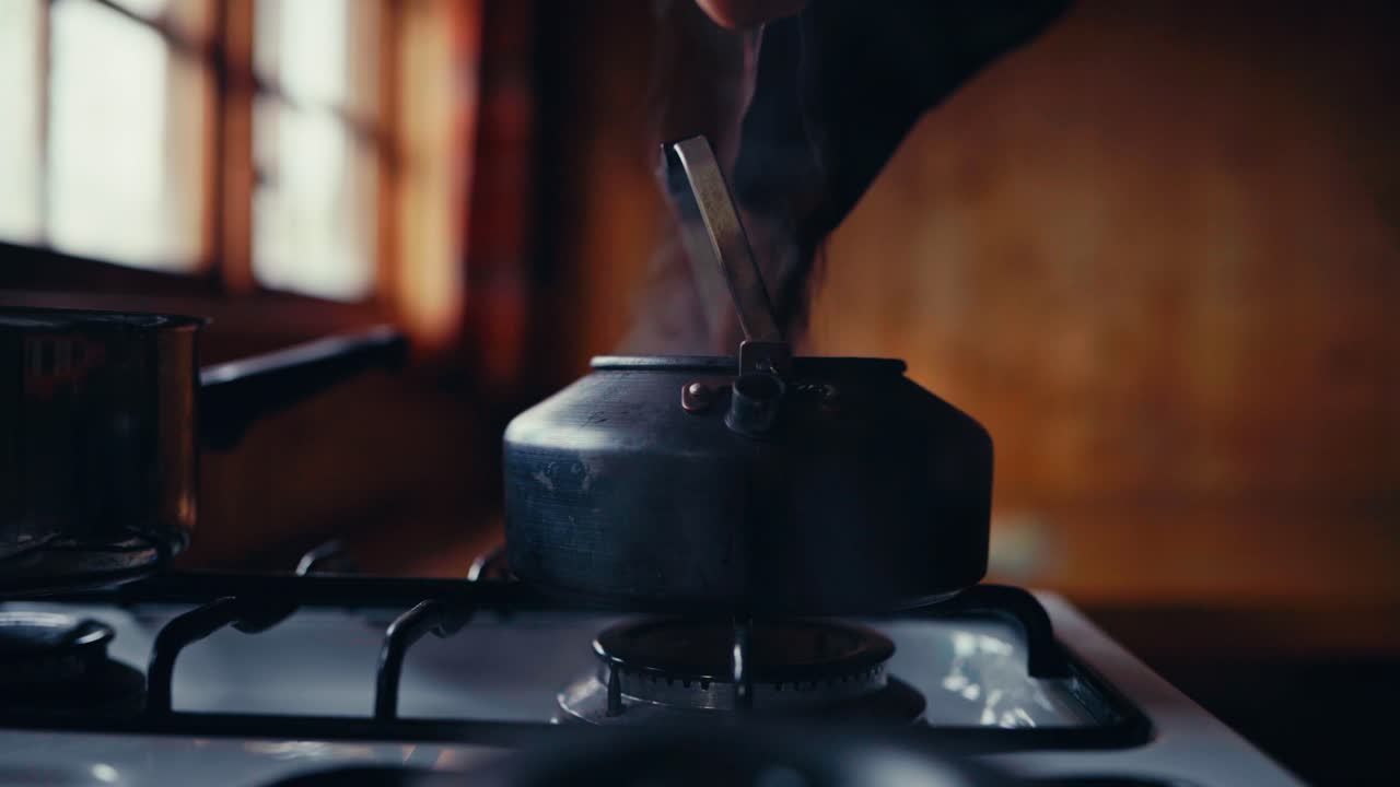 Boiling Tea In A Kettle Over Stovetop. Close-up Shot