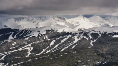 Vail-pass-perspective-of-Copper-Mountain-ski-resort-trail-runs-ten-mile-range-Breckenridge-Leadville-Colorado-epic-ikon-Rocky-snowy-winter-spring-snow-field-peaks-late-afternoon-sunset-cloudy-layer