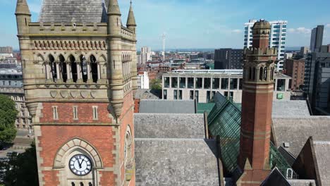 aerial drone flight alongside manchester crown court clocktower rooftop