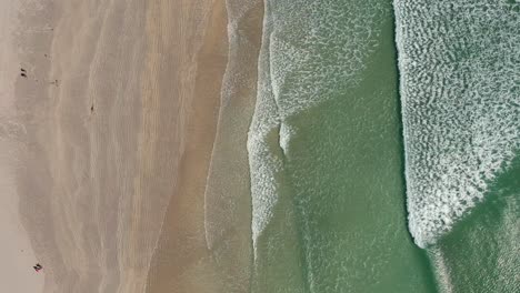 blue waves and sandy beach 4k