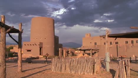 A-beautiful-time-lapse-shot-of-clouds-moving-over-a-traditional-New-Mexico-adobe