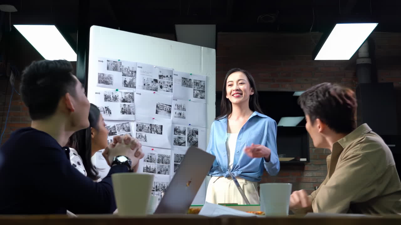 Confident girl sharing her ideas with cheerful colleagues while meeting in office. Businesswomen are having a meeting, discussing and analyzing charts and graphs with team