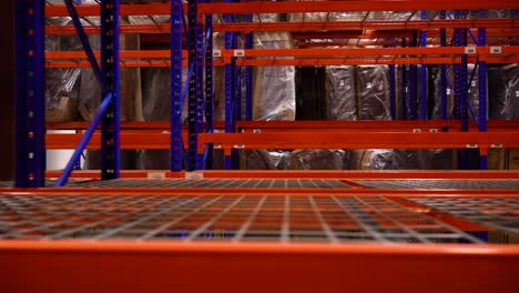 brand new steel warehouse distribution center racking shelves product inventory interior furniture storage metal blue orange industrial equipment business logistics empty transportation sales