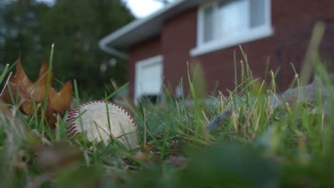 a man picks up a baseball