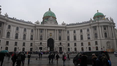 the vienna hofburg: austria's imperial palace with tourists around - slow motion