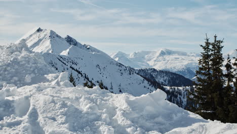 Snowy-peaks-of-mountains,-camera-moving-down