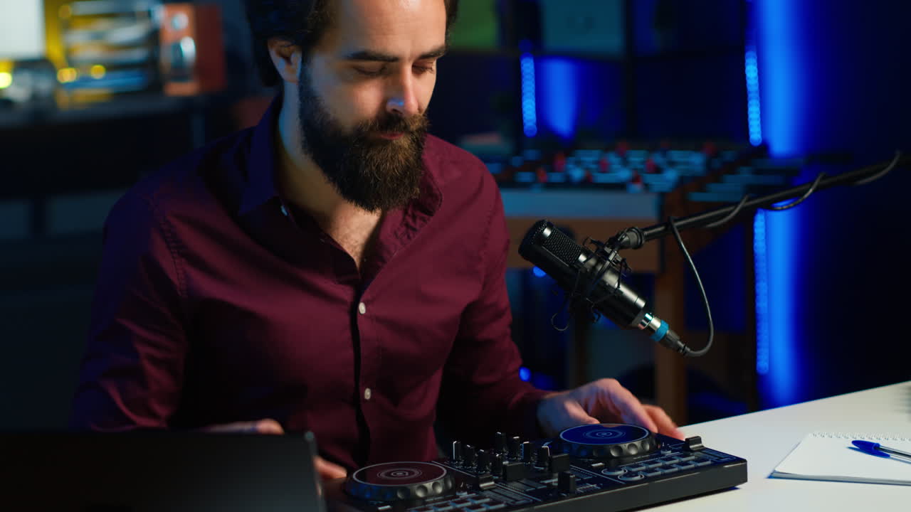 Tech guru filming technology review of newly released DJ controller